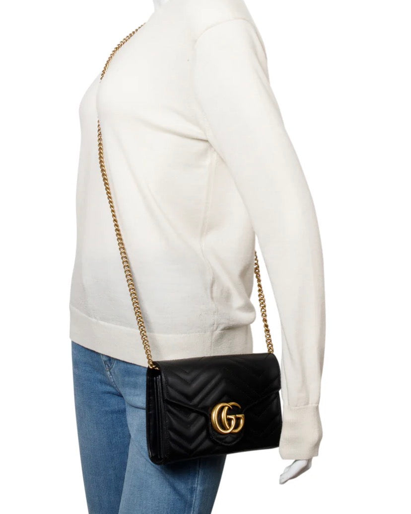 Gucci GG Marmont matelassé leather wallet on chain.
