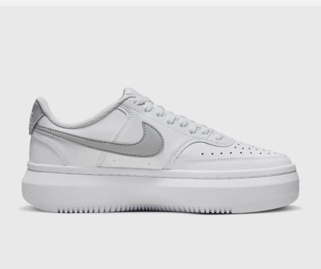 Nike Court Vision Alta sneakers in a white and metallic silver colorway