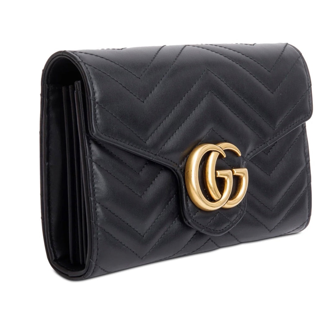Gucci GG Marmont matelassé leather wallet on chain.