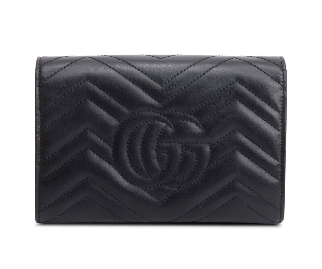 Gucci GG Marmont matelassé leather wallet on chain.