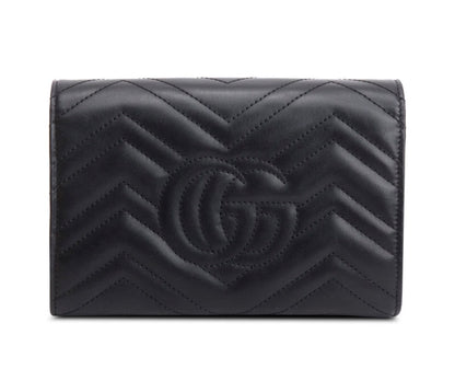 Gucci GG Marmont matelassé leather wallet on chain.