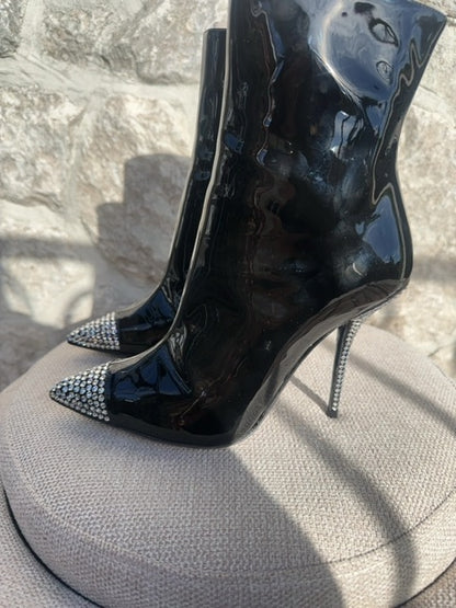 Dolce & Gabbana Patent leather ankle boots featuring crystal embellishments on the pointed toe and heel