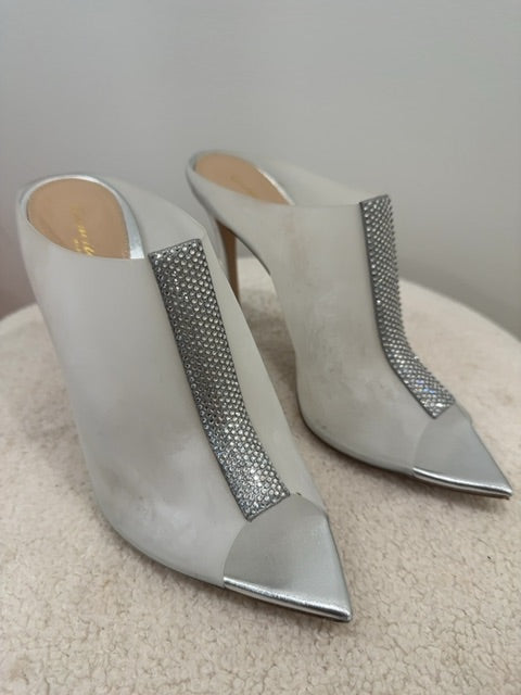 Gianvito Rossi Sigma mules feature a distinctive crystal-encrusted