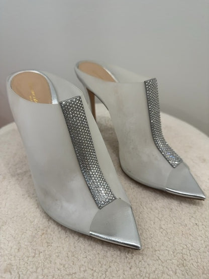 Gianvito Rossi Sigma mules feature a distinctive crystal-encrusted