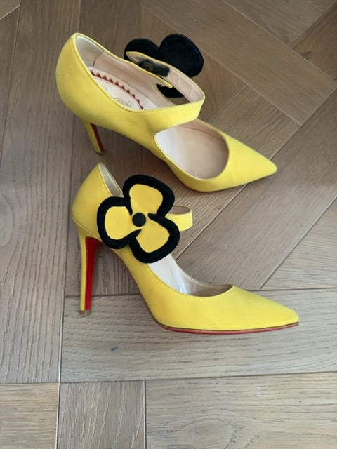 Louboutins Pensee pansy-flower embellishment Mary Jane pumps, featuring yellow satin and the brand's signature red sole
