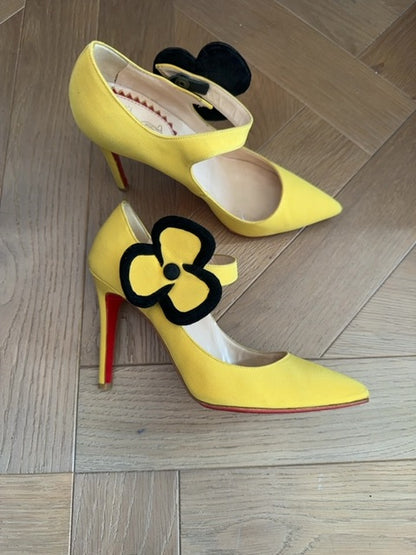Louboutins Pensee pansy-flower embellishment Mary Jane pumps, featuring yellow satin and the brand's signature red sole