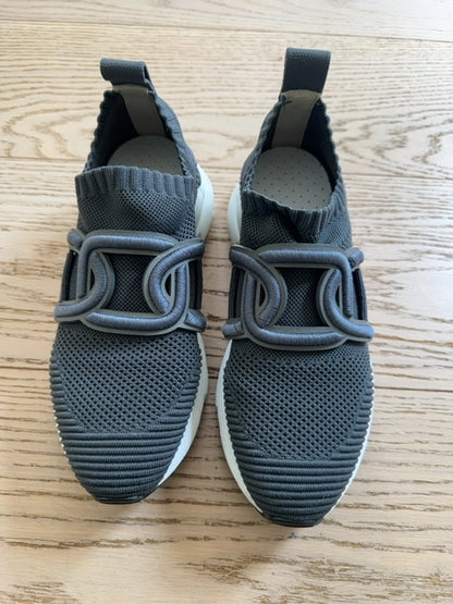 Tods Kate slip-on sneakers featuring a gray stretch-knit upper and a leather chain-style strap detail
