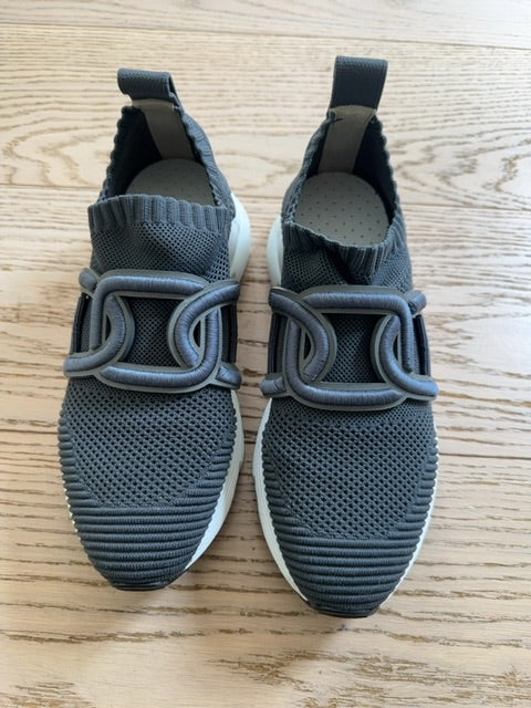 Tods Kate slip-on sneakers featuring a gray stretch-knit upper and a leather chain-style strap detail
