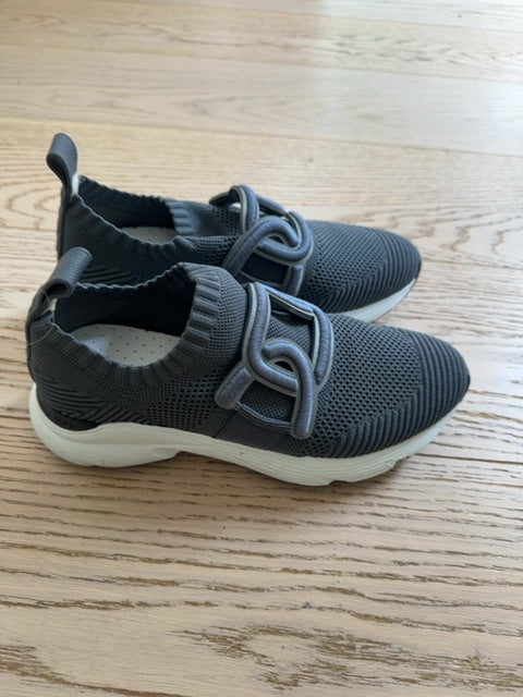 Tods Kate slip-on sneakers featuring a gray stretch-knit upper and a leather chain-style strap detail