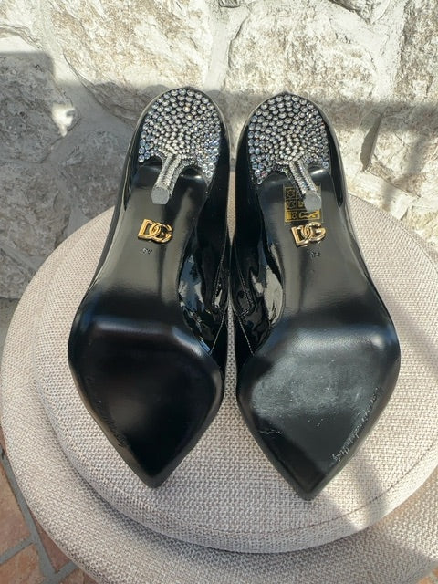 Dolce & Gabbana Patent leather ankle boots featuring crystal embellishments on the pointed toe and heel