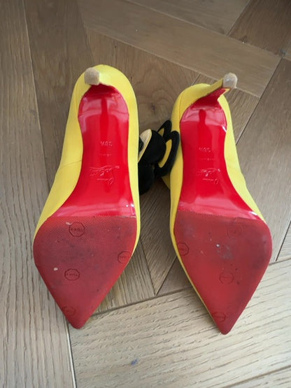 Louboutins Pensee pansy-flower embellishment Mary Jane pumps, featuring yellow satin and the brand's signature red sole