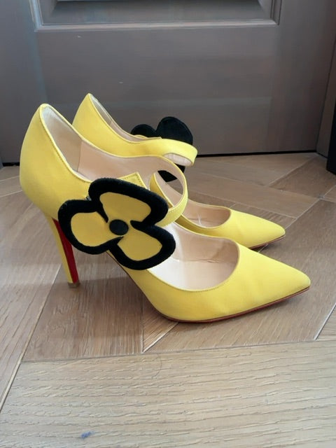 Louboutins Pensee pansy-flower embellishment Mary Jane pumps, featuring yellow satin and the brand's signature red sole