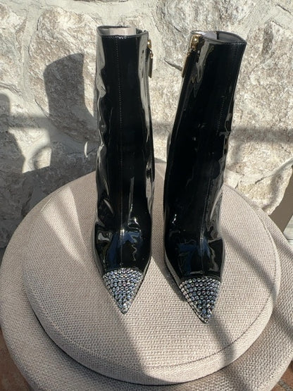 Dolce & Gabbana Patent leather ankle boots featuring crystal embellishments on the pointed toe and heel